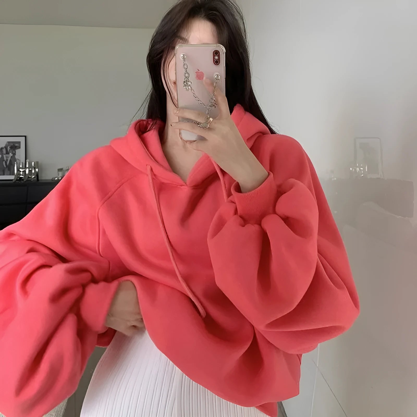 Watermelon red women's silk hooded sweater on hanger showing sleeveless design