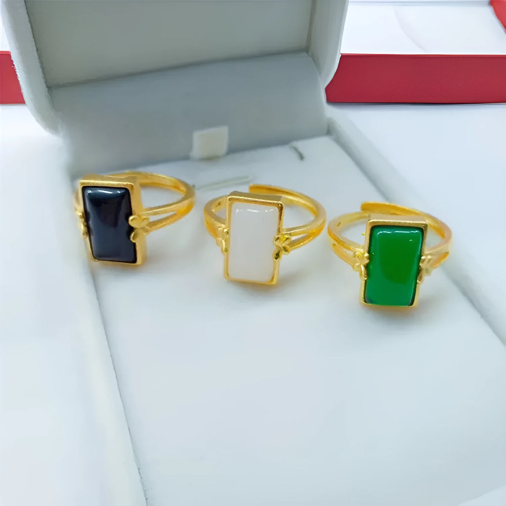 Adjustable brass gold-plated ring with gemstone inlays in black, green, or white colour options