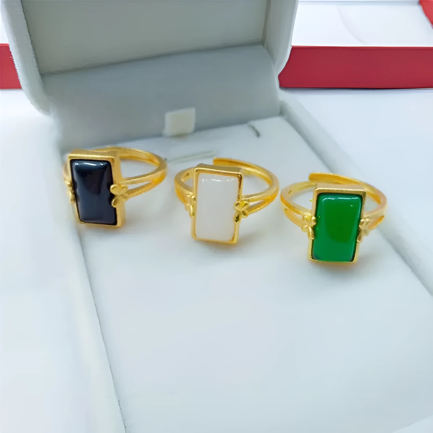 Adjustable brass gold-plated ring with gemstone inlays in black, green, or white colour options