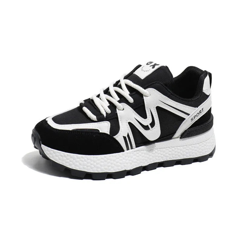 Women's black platform casual trainers with round toe and lace-up front on a white background.