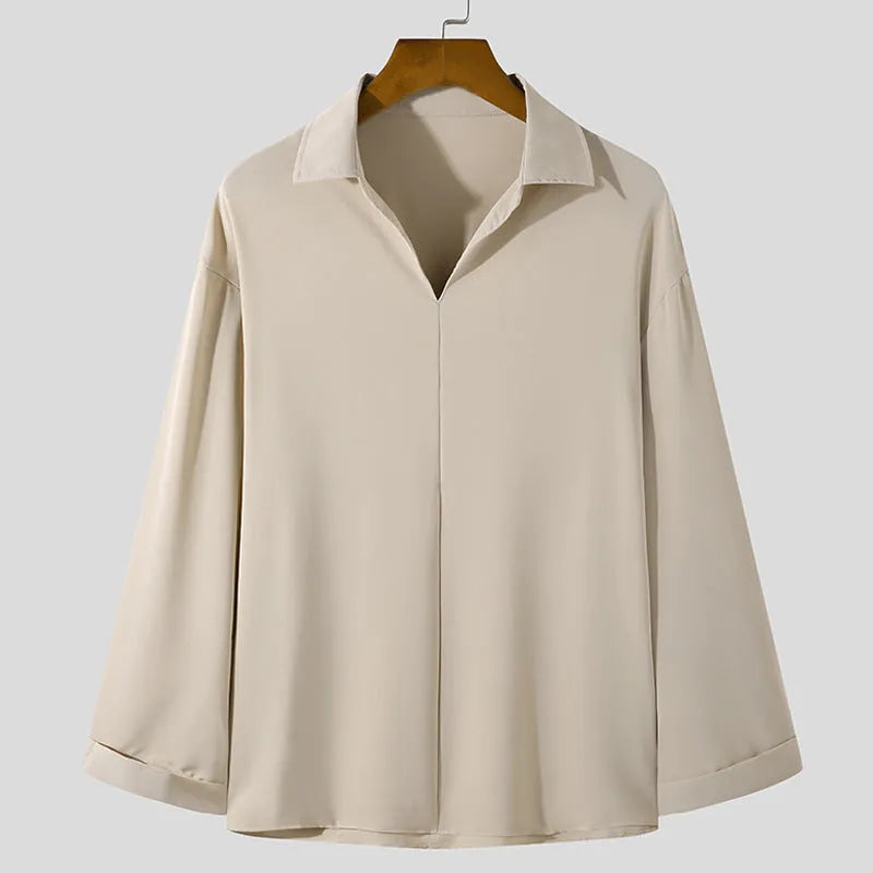Men's loose lapel casual shirt in solid colour on a hanger, showing long sleeves and pullover style.