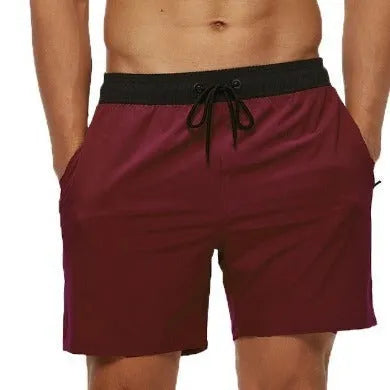 Men's blue training shorts with stitching waist detail and headband pocket