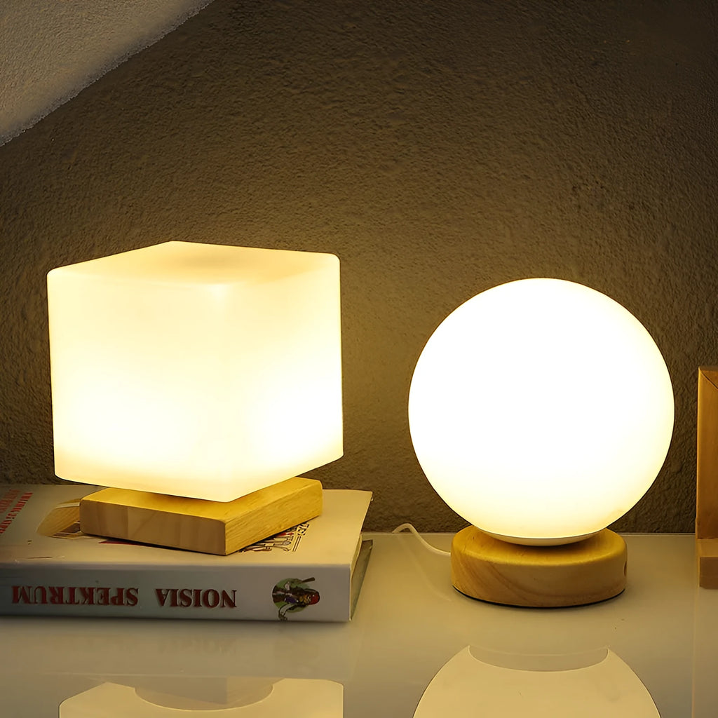 Nordic solid wood USB table lamp with touch dimming in white cube, cylinder, and ball styles on a wooden surface.