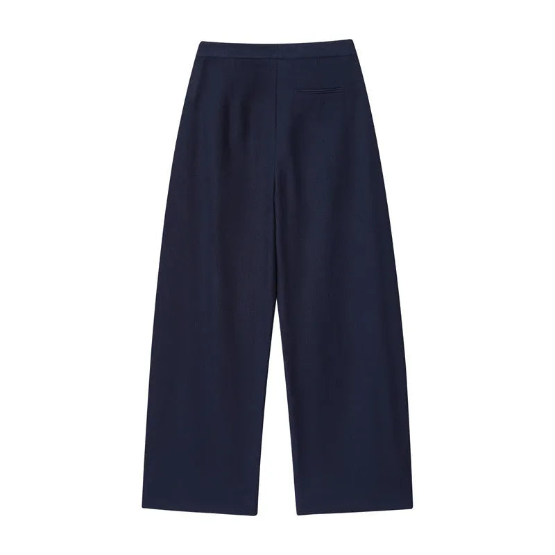 Women's linen blend co-ord set showing flounced sleeve off-neck top with wide leg trousers in temperament commute style