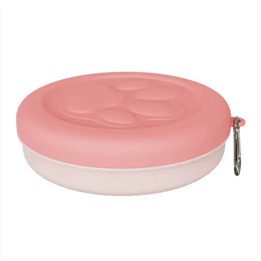 Portable plastic pet food bowl in light pink or green for outdoor travel feeding