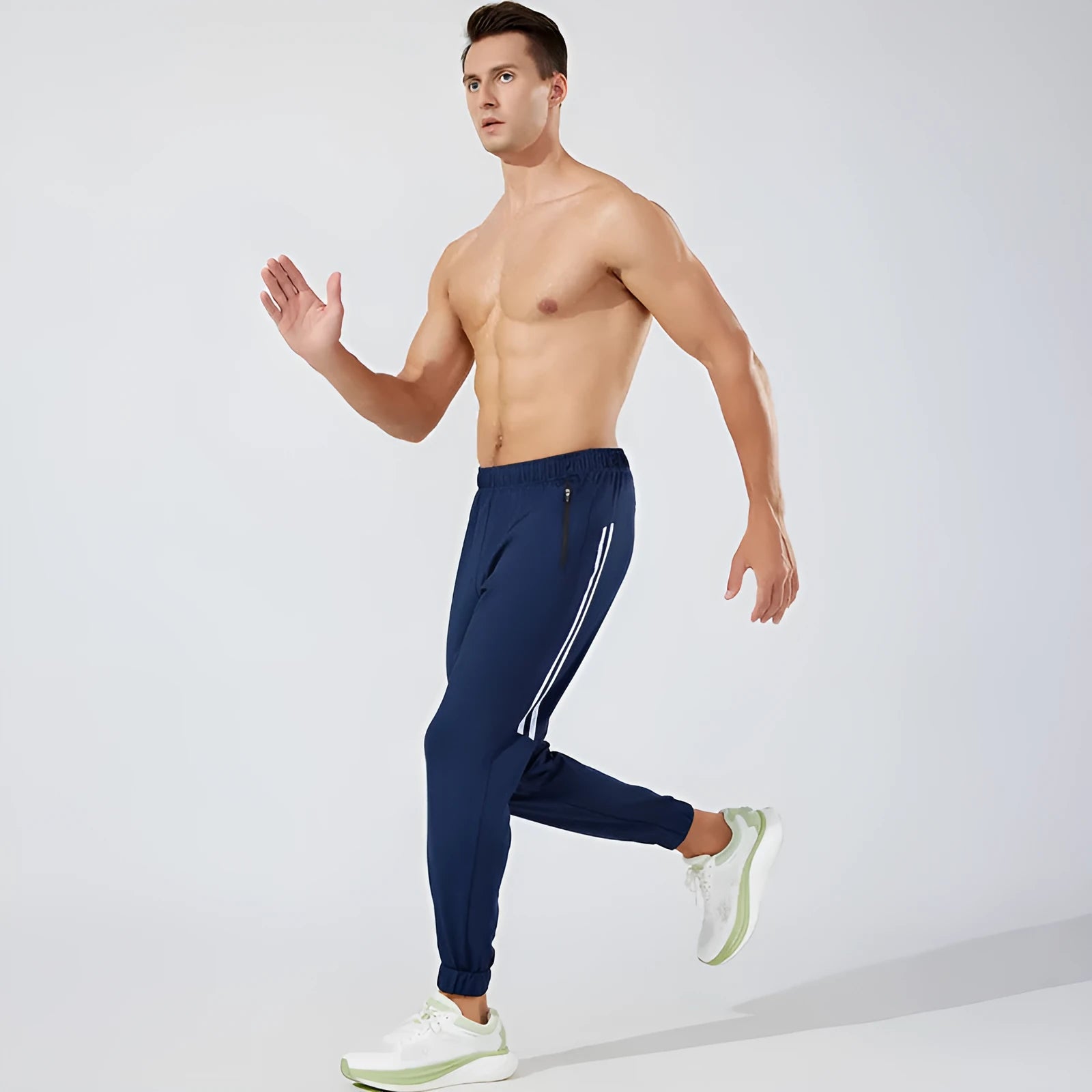 Men's black polyester running trousers with mid waist and full leg length for exercise.
