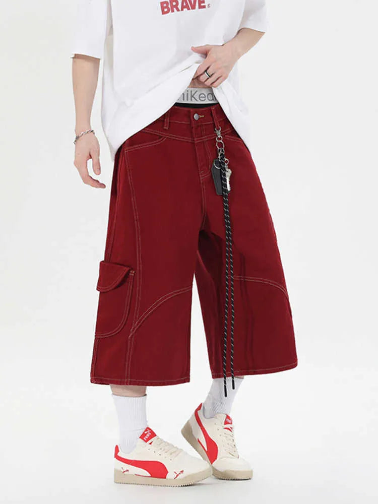 Retro black denim wide-leg shorts with multiple pockets on a mid-waist fit model.