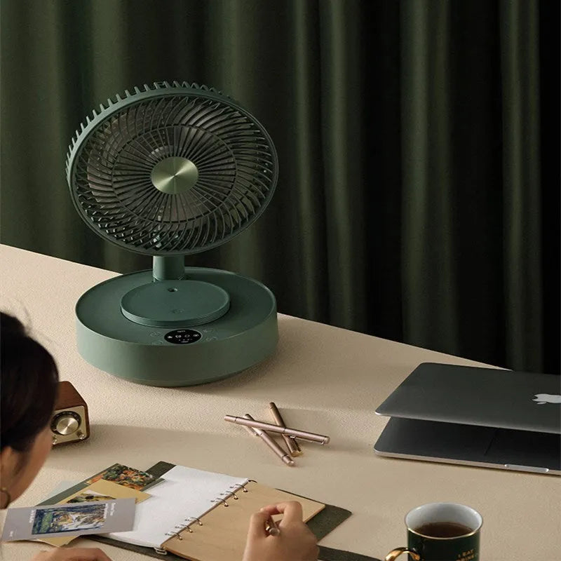 Green telescopic rechargeable floor fan extended to full height with remote control