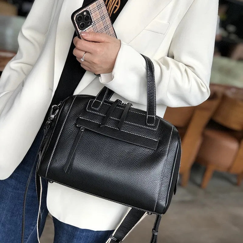 Soft genuine leather shoulder messenger bag with Boston lychee pattern and internal organiser pockets.