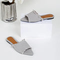 Women's denim flat slippers with tassel detail and leather lining in solid colour
