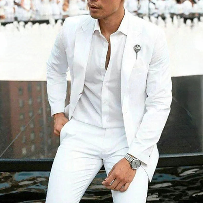 Men's white slim fit two-piece cotton suit on a hanger, showing jacket and trousers for formal events.