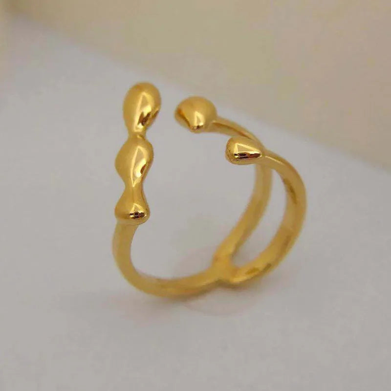 Adjustable opening brass fashion ring with circular sphere decoration in gold or silver finish