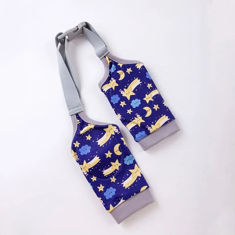 Blue adjustable dog elbow protector sleeve with padded patch and matching scarf on a large dog's front leg.