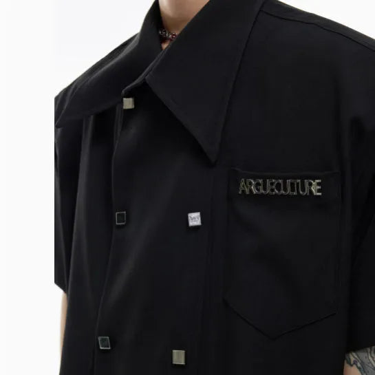 Men's loose fit short sleeve casual shirt with spliced panelling and metal button details.