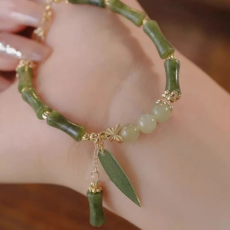 Handmade Chinese style glass women's bracelet featuring bamboo joint design elements.