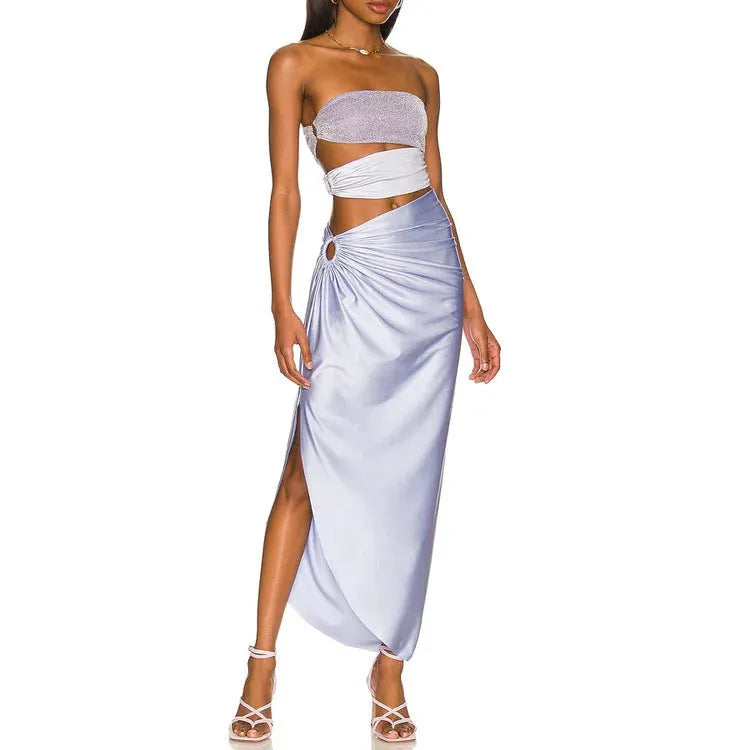 Purple hollow one-piece swimsuit with matching wrap skirt on a model.