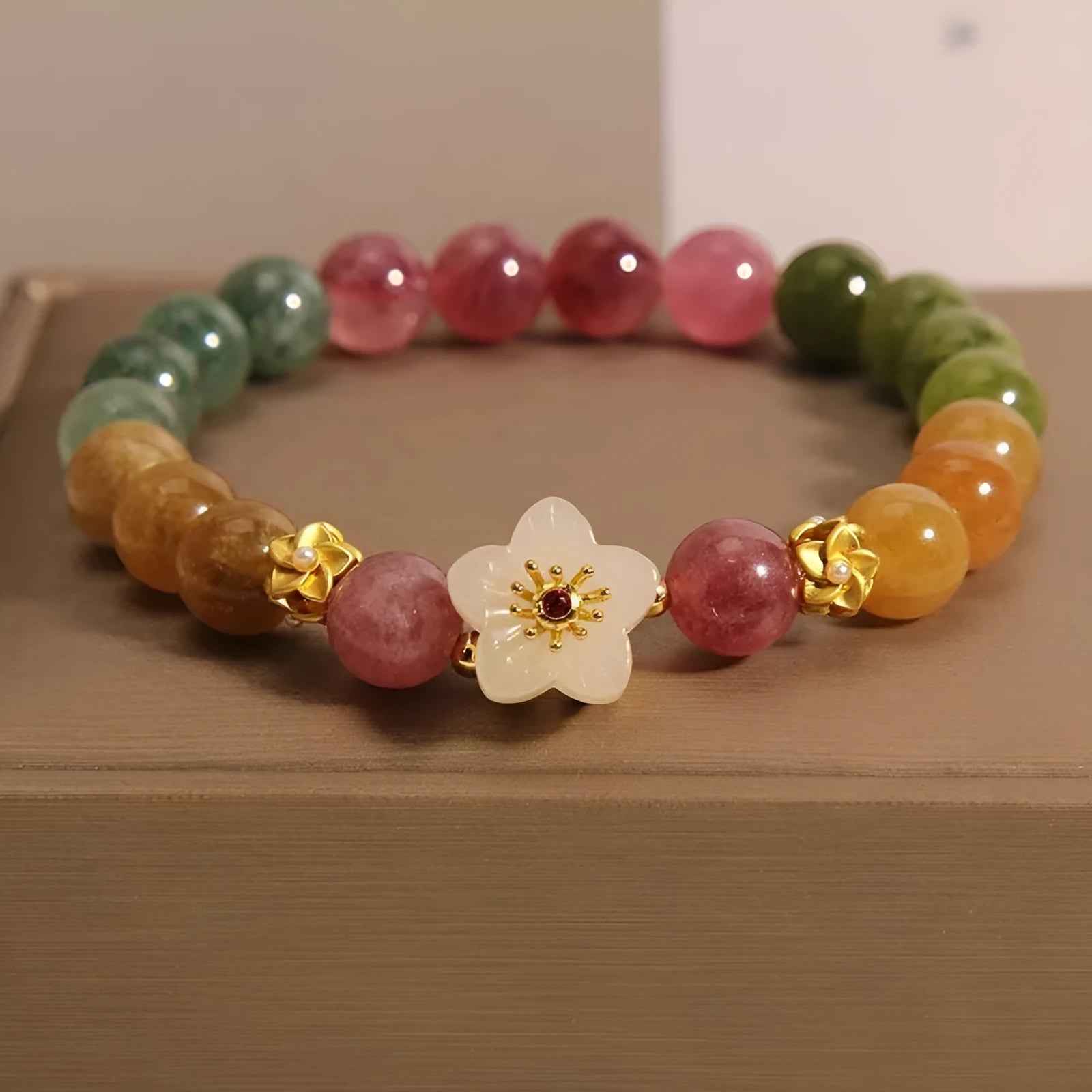 Natural colour tourmaline bracelet with geometric design showing floral or Chinese Fu character options