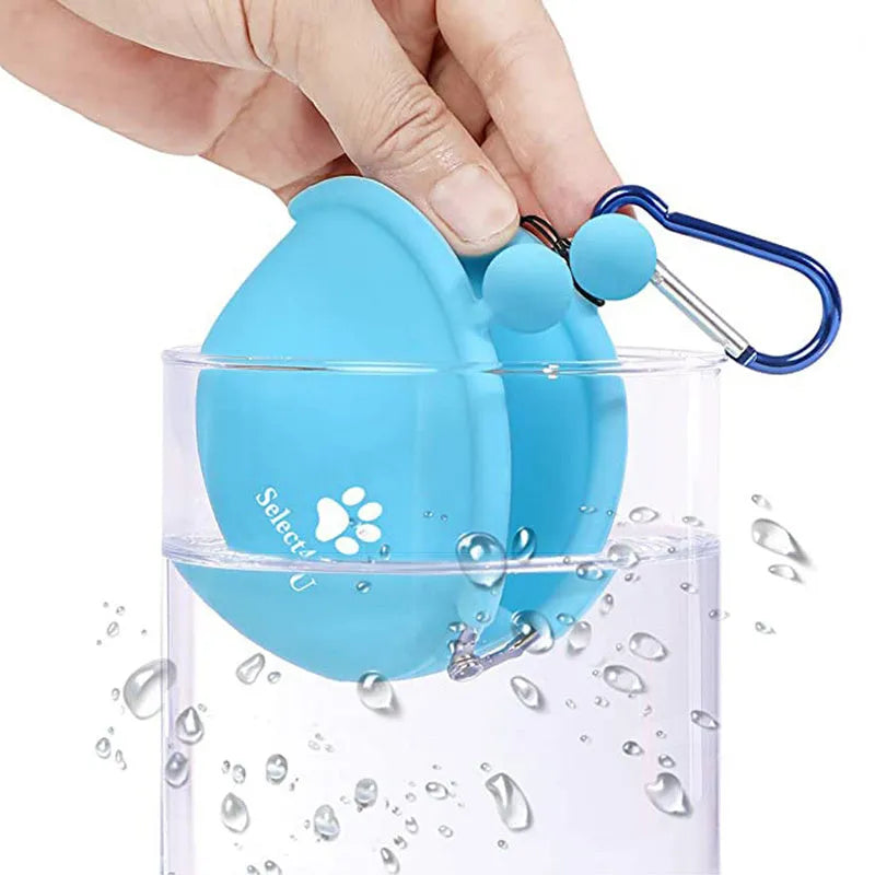 Yellow silicone dog training treat pouch with hook-and-loop waist strap, shown with dog biscuits.