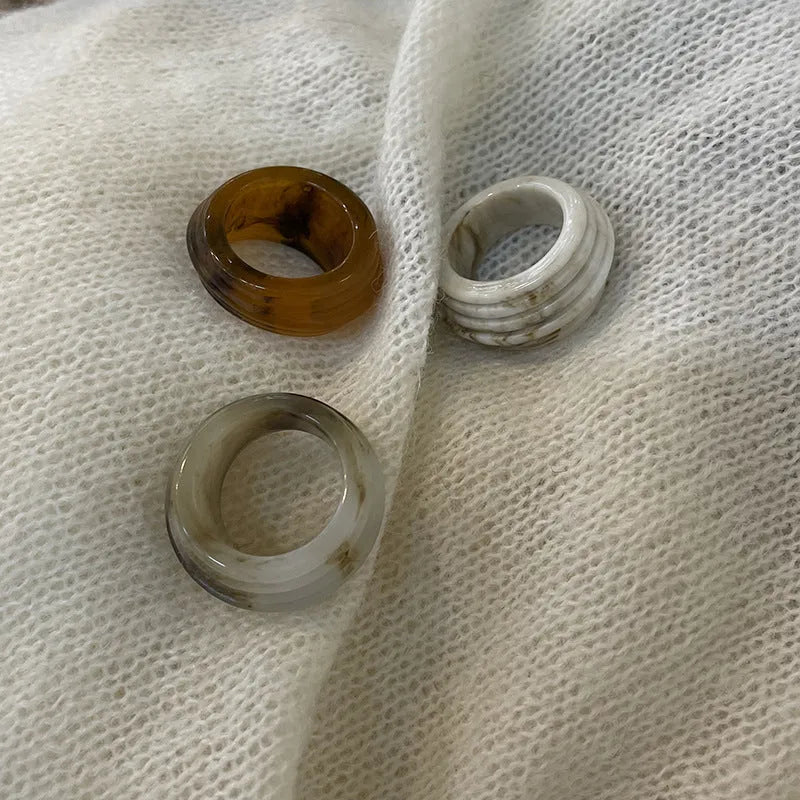 Chinese style irregular geometric resin wide ring in brown and white colours.