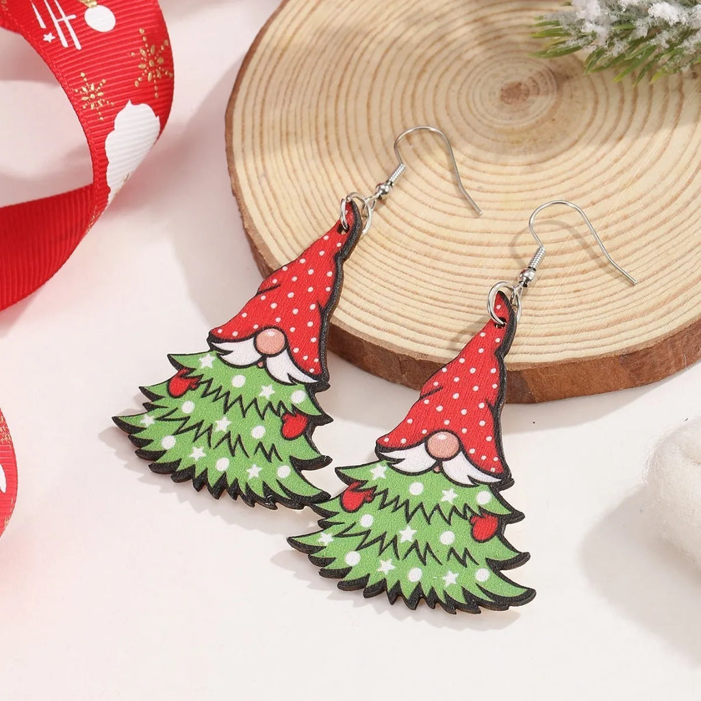 Wooden Christmas earrings with printed tree and snowman designs featuring geometric shapes
