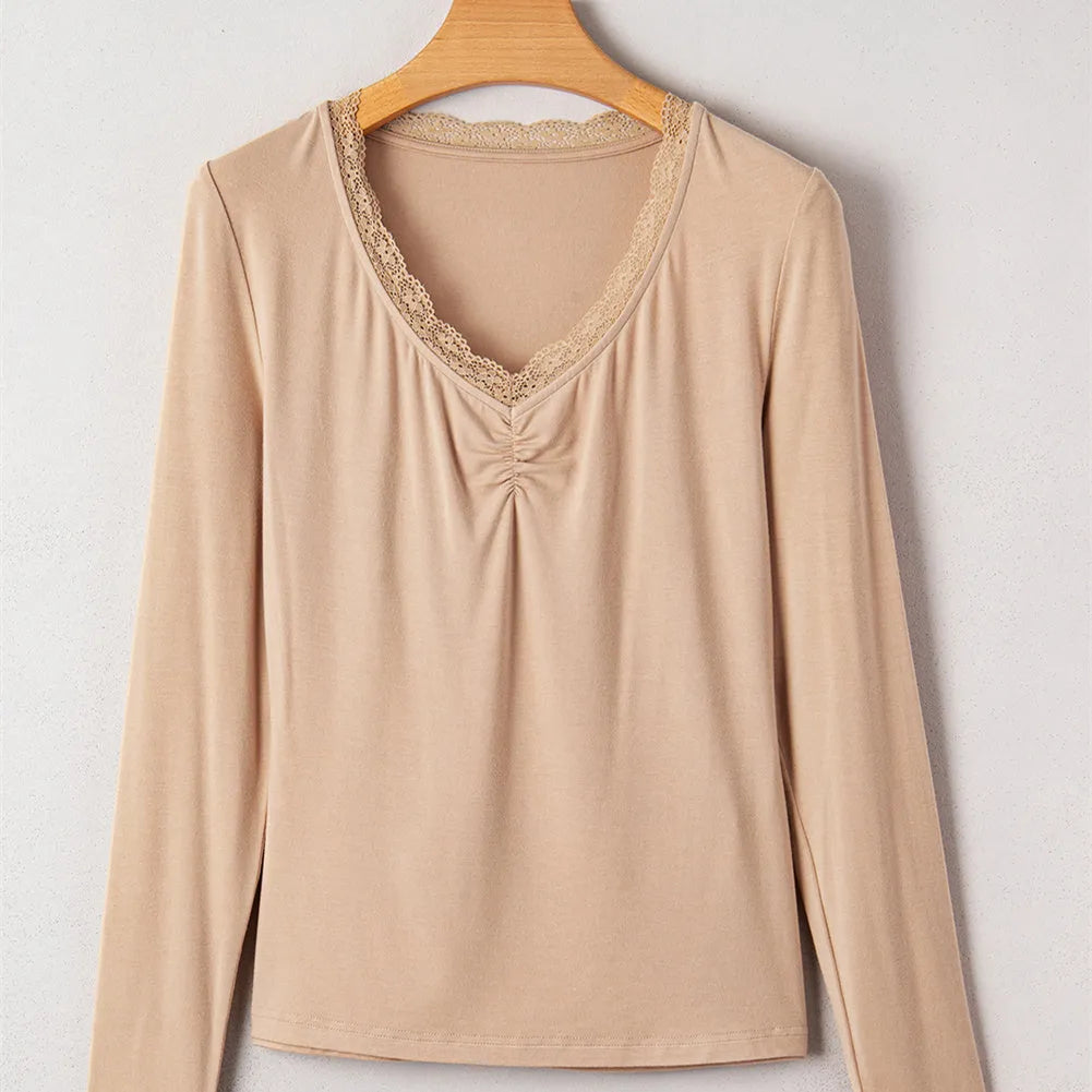 Women's red slim-fit long-sleeved top with lace trim on a solid colour background.