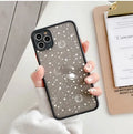 Black and white iPhone cases with soft touch surface showing raised edge protection