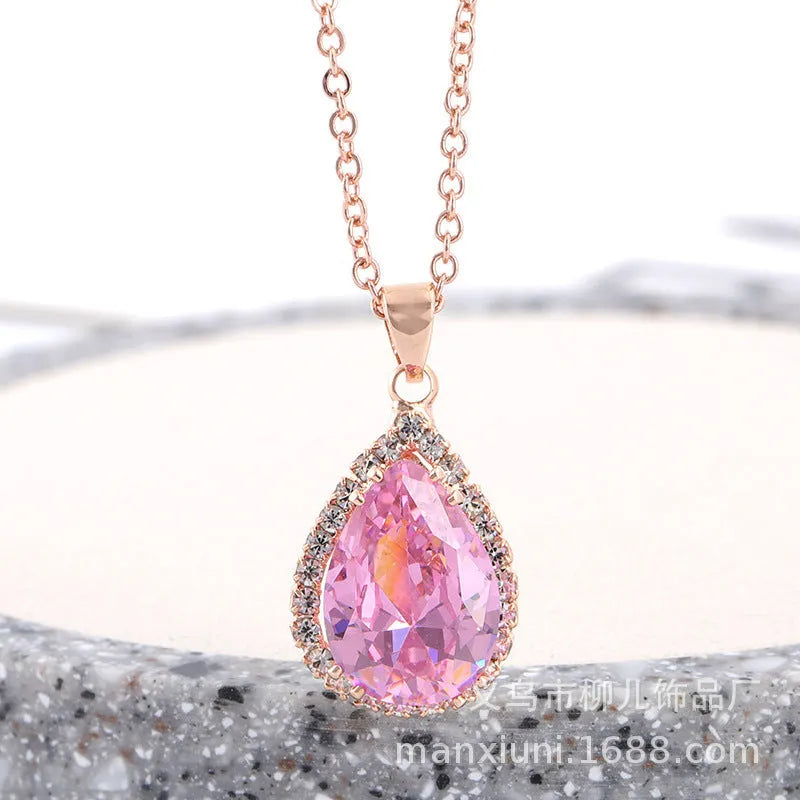 Women's alloy water drop necklace with rose gold electroplated colour and rhinestone inlays on a geometric pendant.