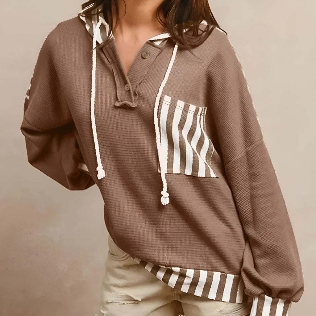 Straw yellow hoodie with waffle texture striped patchwork design featuring drawstring hood and button neck closure