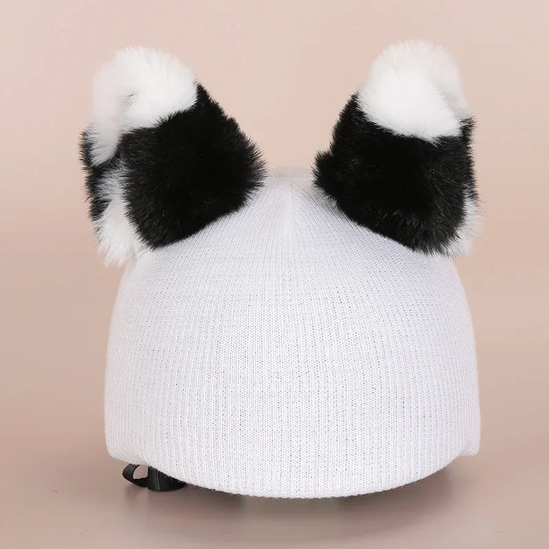 Cute cartoon plush fabric hat cover on a ski helmet for decoration.