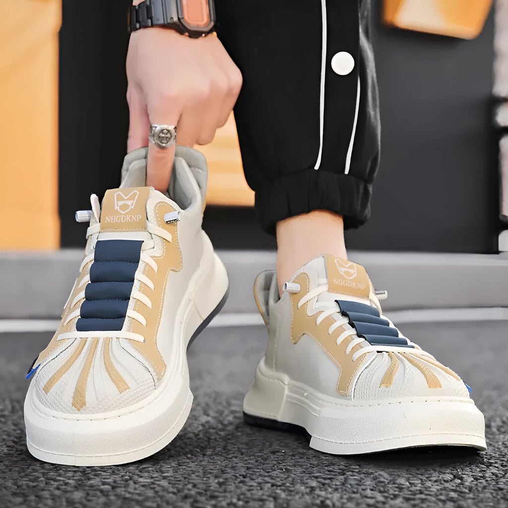 Men's beige low-top sneakers with elastic band closure and round toe on a white background.