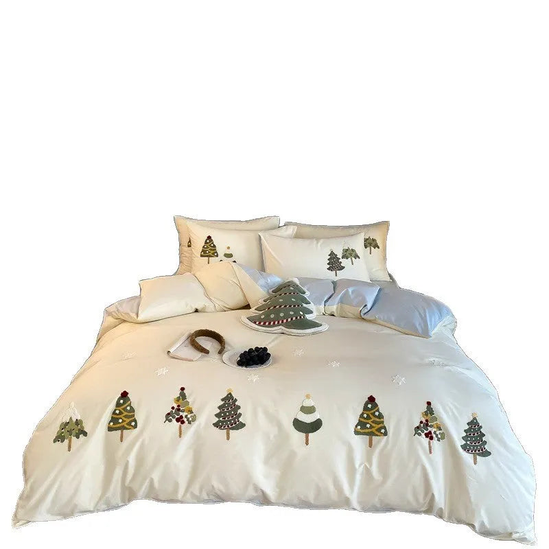 Cream blue embroidered Christmas tree and flowers on a cotton duvet cover with matching pillowcases