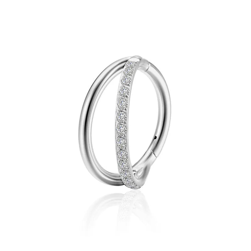 Titanium alloy fork-style nose ring on a plain background, showing the corkscrew shape and post.