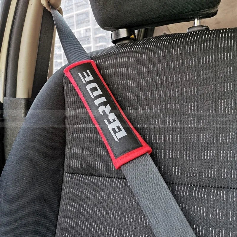 Car seat belt shoulder pads in black, blue and red with cotton fabric and sponge padding