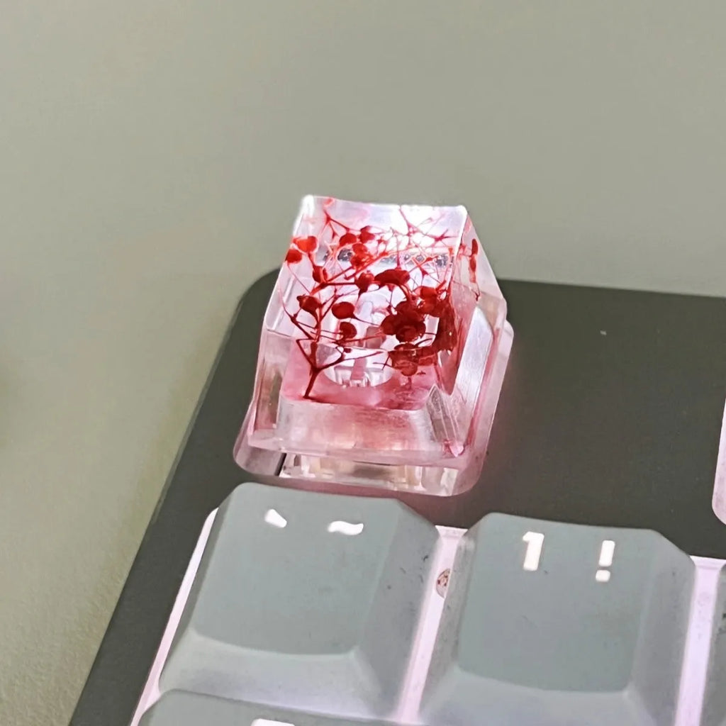 Green resin transparent keycap with glitter starry sky design for mechanical keyboards.