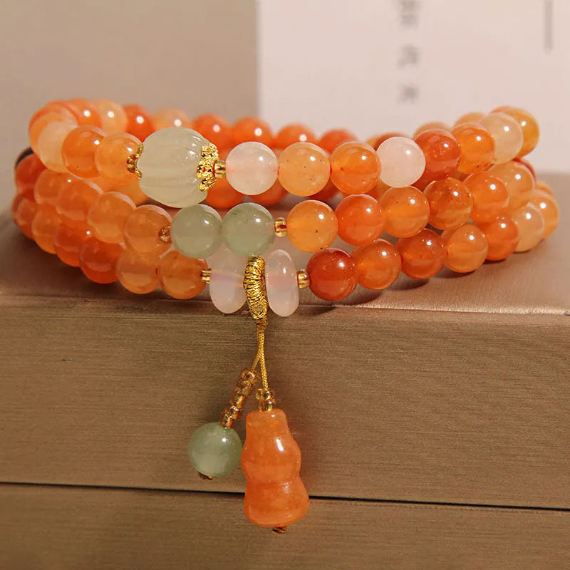 Artistic antique natural Jinsi Jade multi-layer bracelet with pumpkin beads and calabash pendant on white background