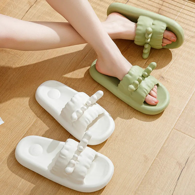 Deer horn design EVA flip flop slippers in light yellow, showing hollow out upper and textured sole.
