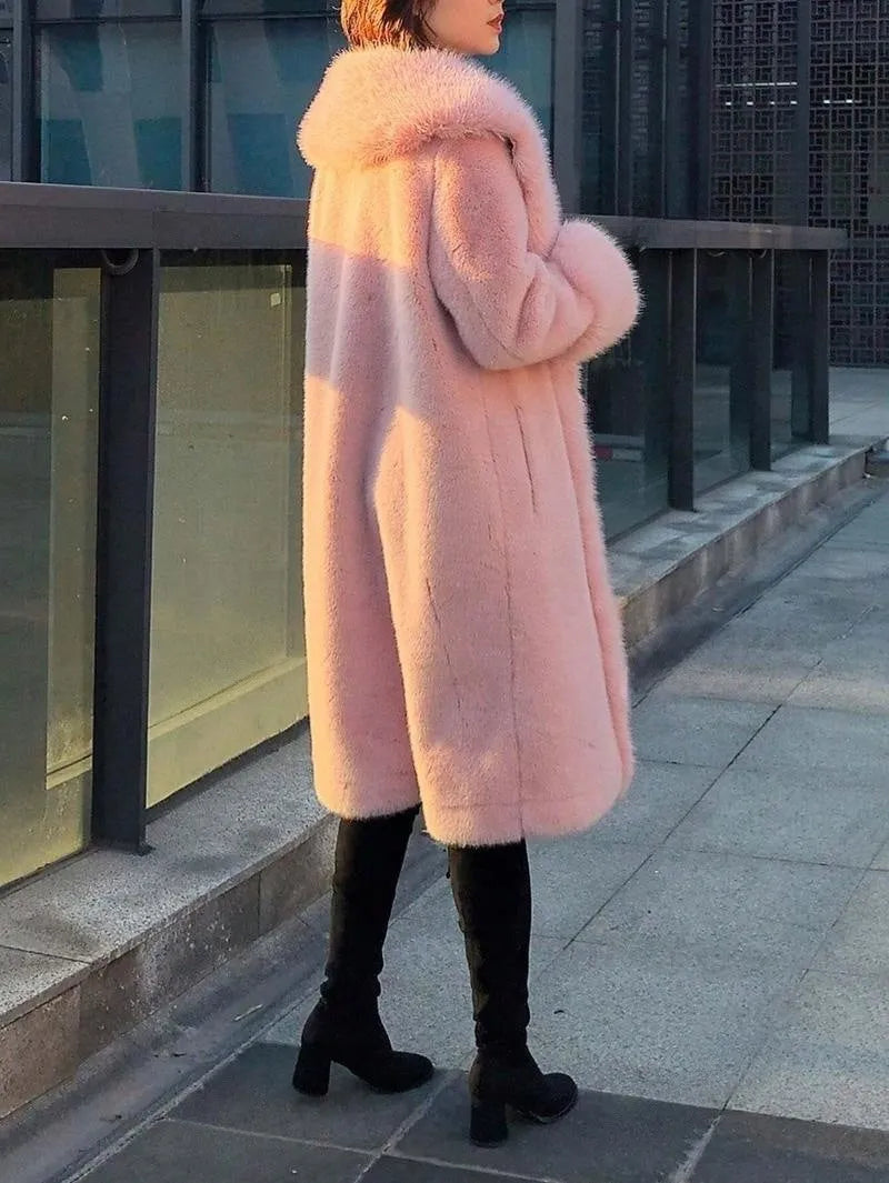 Women's grey mid-length coat with thick faux rabbit fur trim and a fur collar.