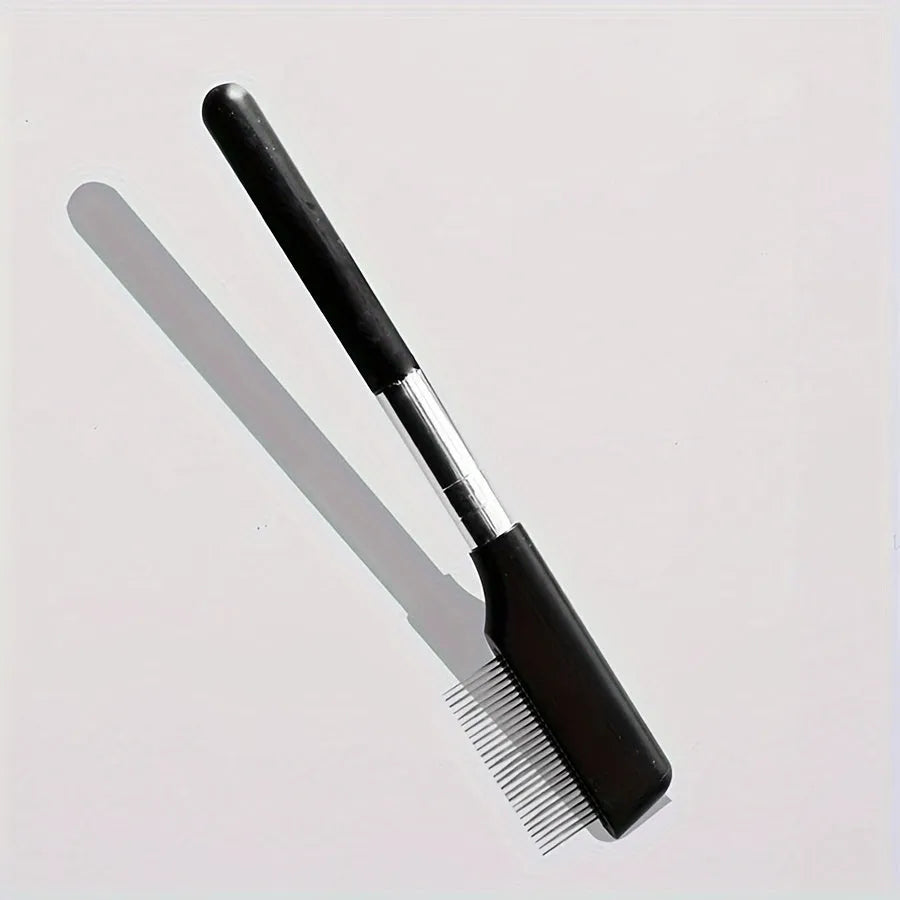 Black pet grooming brush with soft silicone bristles for gentle eye cleaning on dogs and cats