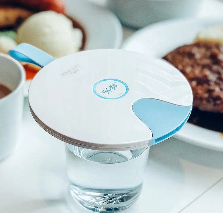 Portable blue UV baby bottle steriliser unit showing compact size and USB charging port.