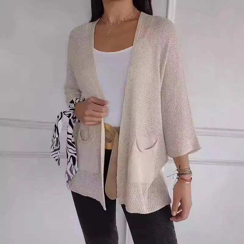 Women's waffle knit cardigan coat with nine-quarter sleeves in army green colour showing pocket detail