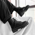 Men's black platform Dr Martens boots with 8 eyelets and a side zipper on a frosted cowhide upper.