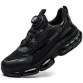 Lightweight black safety work shoes with laces and a steel toe cap on a grey background.