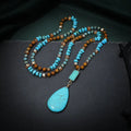 Turquoise blue imitation mineral pendant necklace with mixed gem inlaid details on ball bead chain