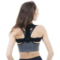 Black elastic adjustable posture correction strap laid flat on a white background.