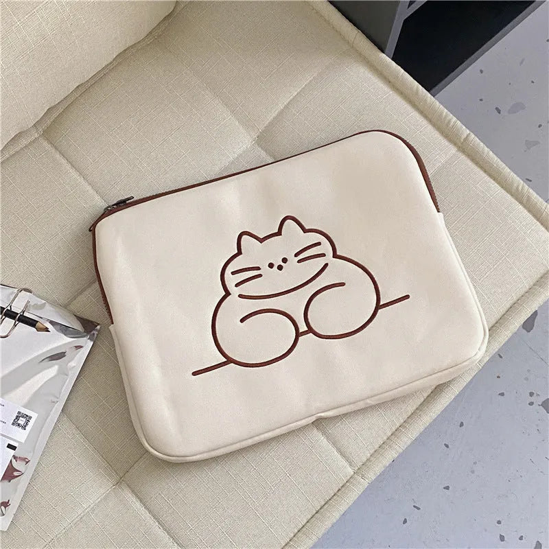 Nylon protective sleeve for tablet with embroidered fat cat design and zipper closure.