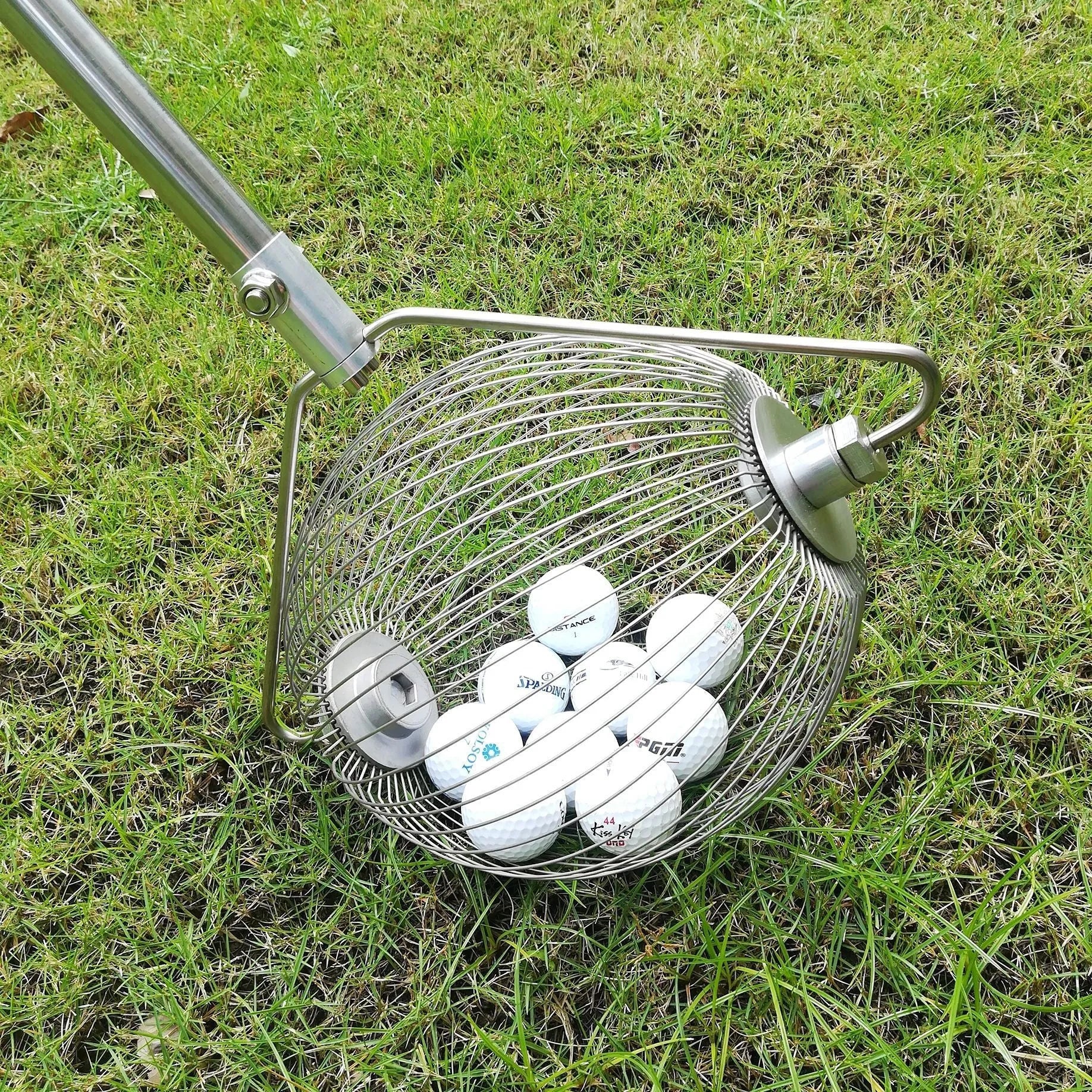 Metallic-coloured stainless steel golf ball picker with magnetic end for trolley attachment