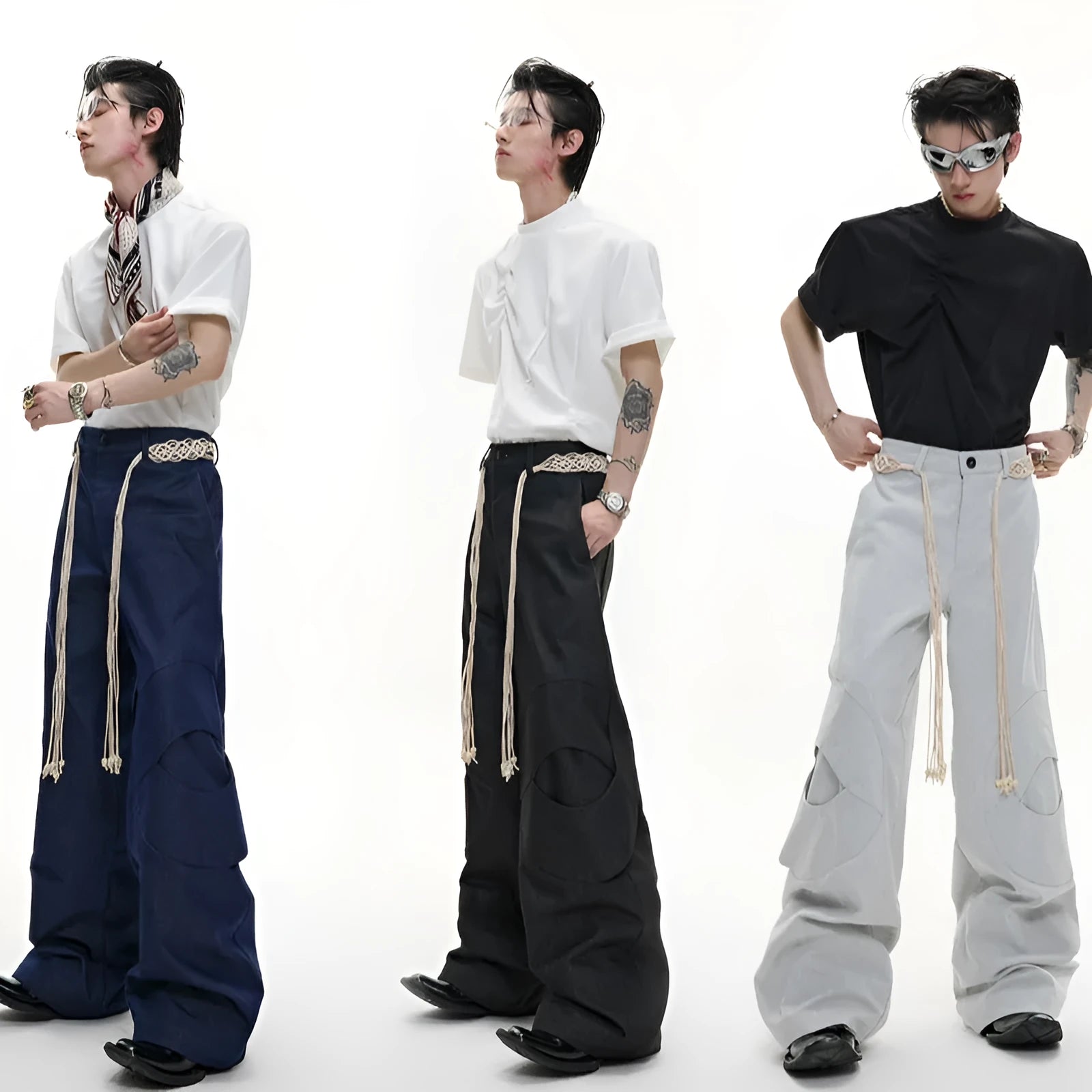 Men's dark blue straight-leg jeans showing heavy belt stitching, 3D cutting, zipper decoration, and a loose fit.