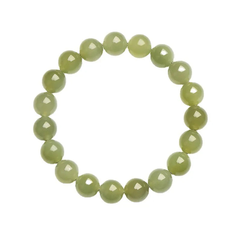 Polished Hetian jade ball bracelet on wrist, showing clear beads.