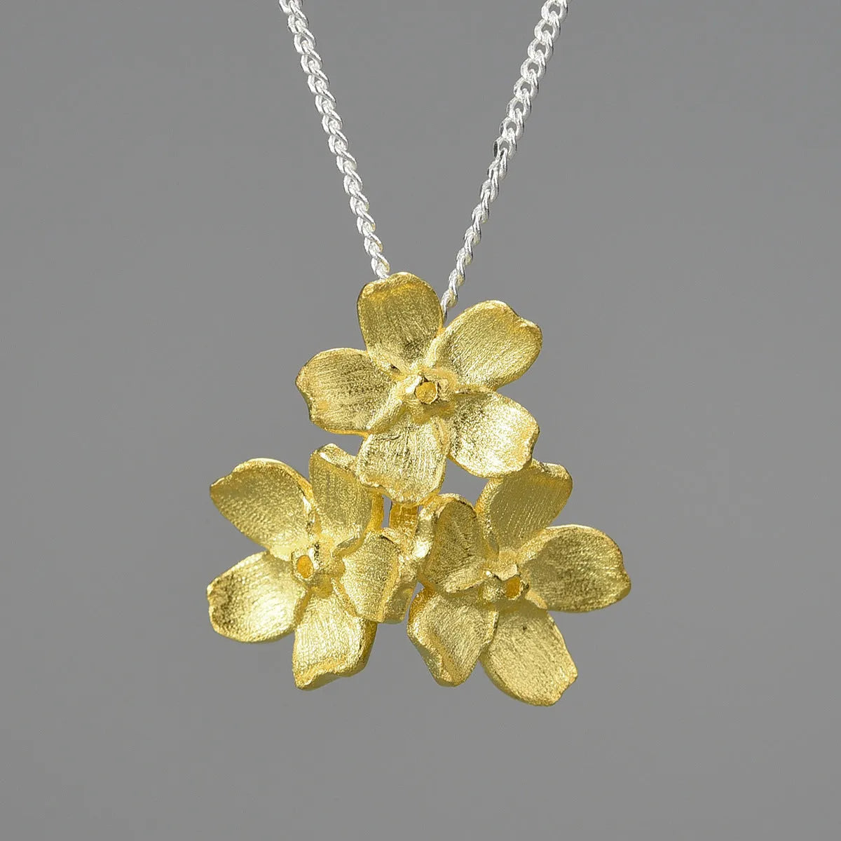 Sterling silver Myosotis flower pendant with pastoral design in electroplated finish