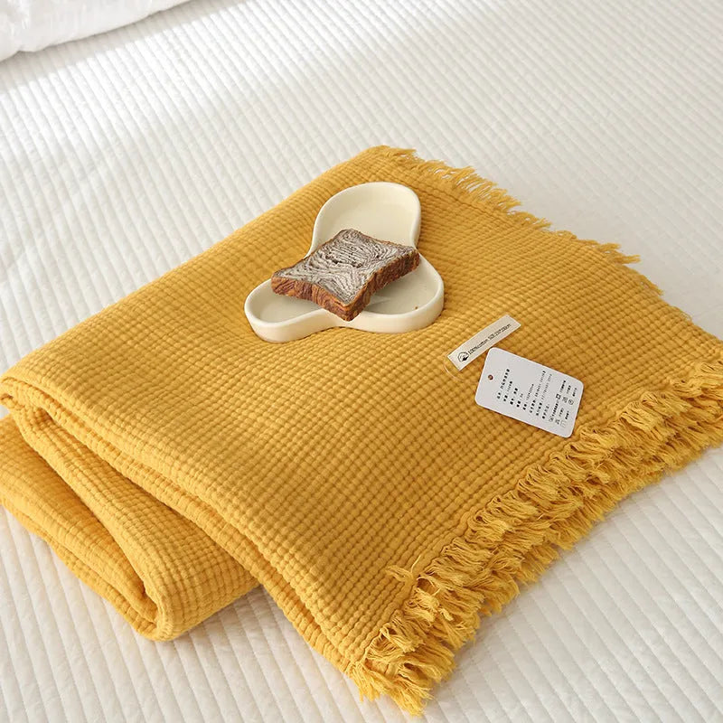 Four-layer gauze cotton blanket with tassel trim in avocado green colour